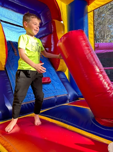Child having fun inside a BounceATL bounce house rental